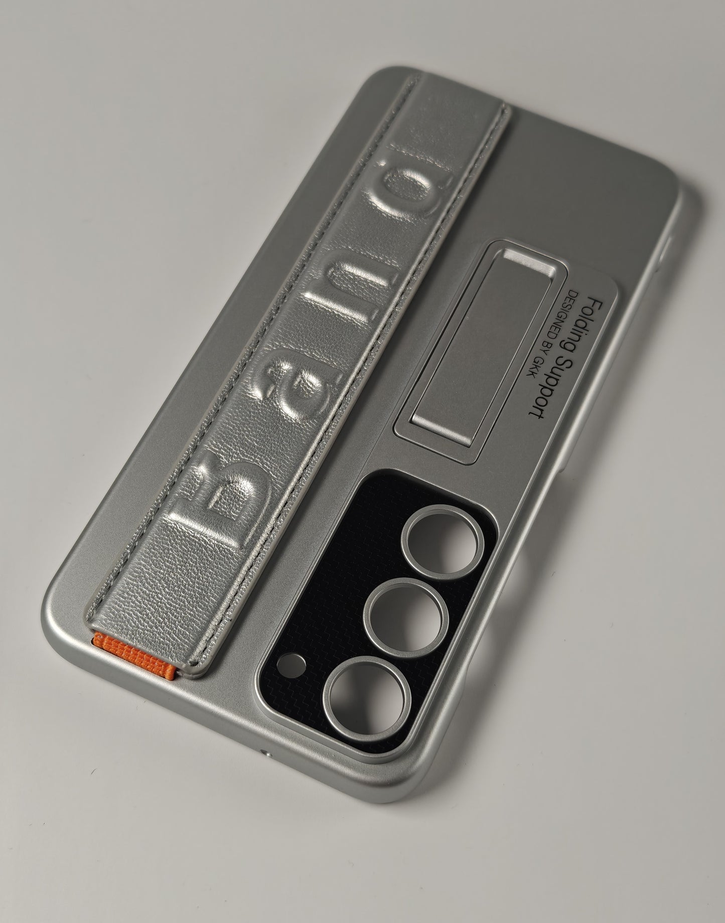 S23 Plus GKK suojakuori tukijalalla ja nauhalla